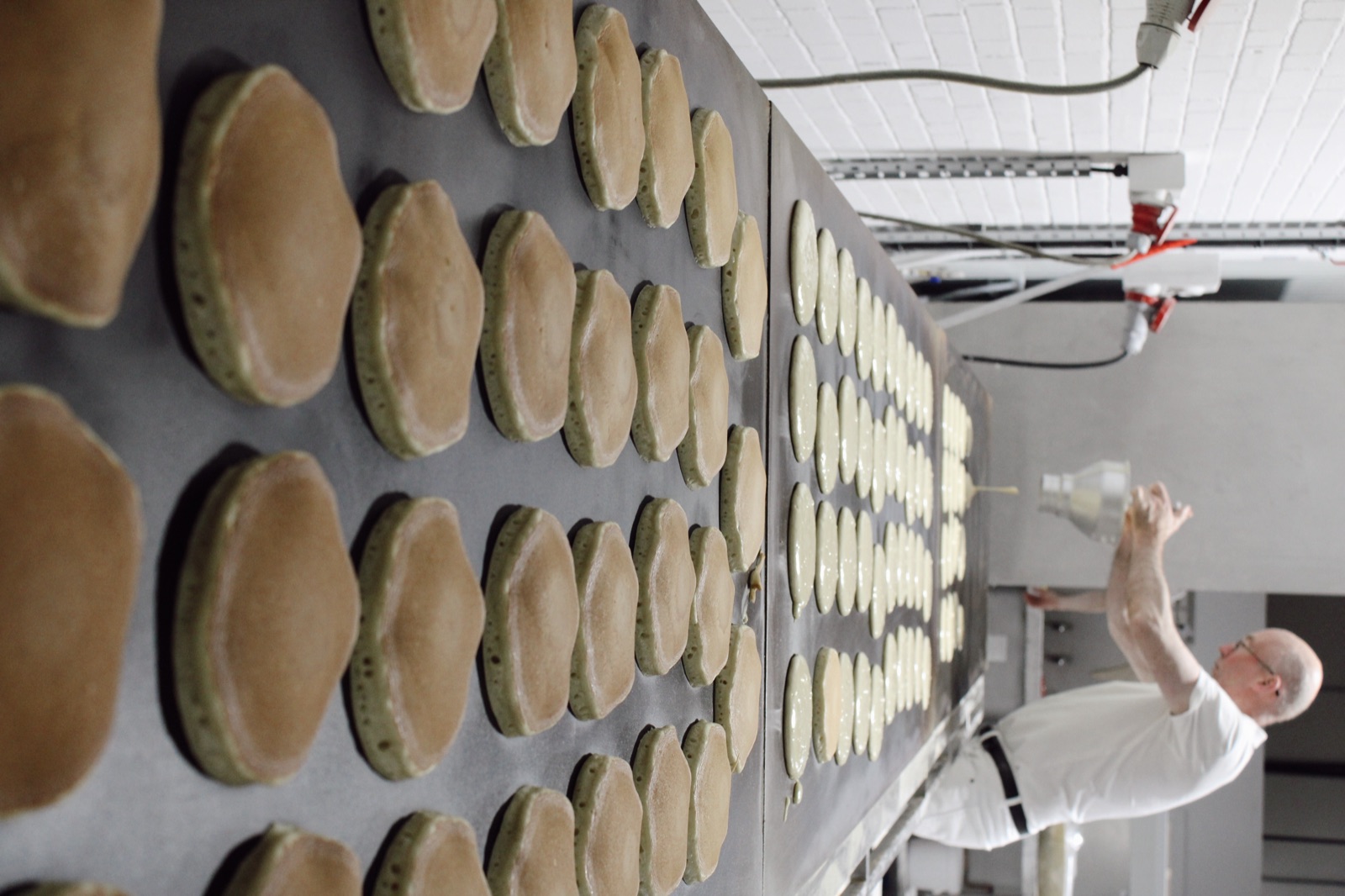 Baker loading bread onto the Knotts Bakery production rack