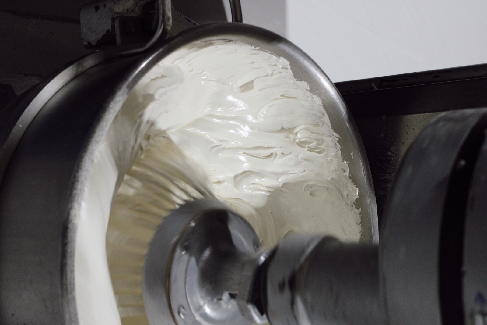Fresh cream being whipped in the industrial mixer at Knotts Bakery